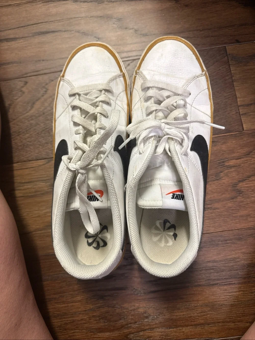 Nike White Low-Top Sneakers with Black Swoosh and Brown Trim